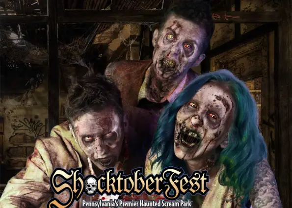 Three zombies with gruesome, glowing eyes pose in a dark, ruined setting; the poster reads "ShocktoberFest" with the subtitle "Pennsylvania's Premier Haunted Scream Park".